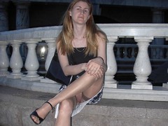 Redhead chick showing her pussy and long legs in stockings. Image 8