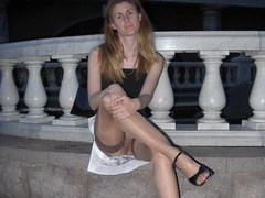 Redhead chick showing her pussy and long legs in stockings. Image 9