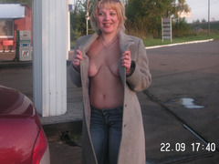 Sexy russian milf posing outdoors. Image 1
