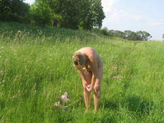 See my exwife's nude pics posing outdoors on the meadow and sitting on my car. Image 9