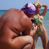 Posing naked on the beach