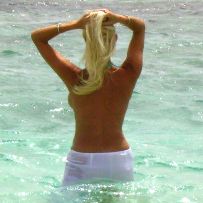 Posing naked on the beach